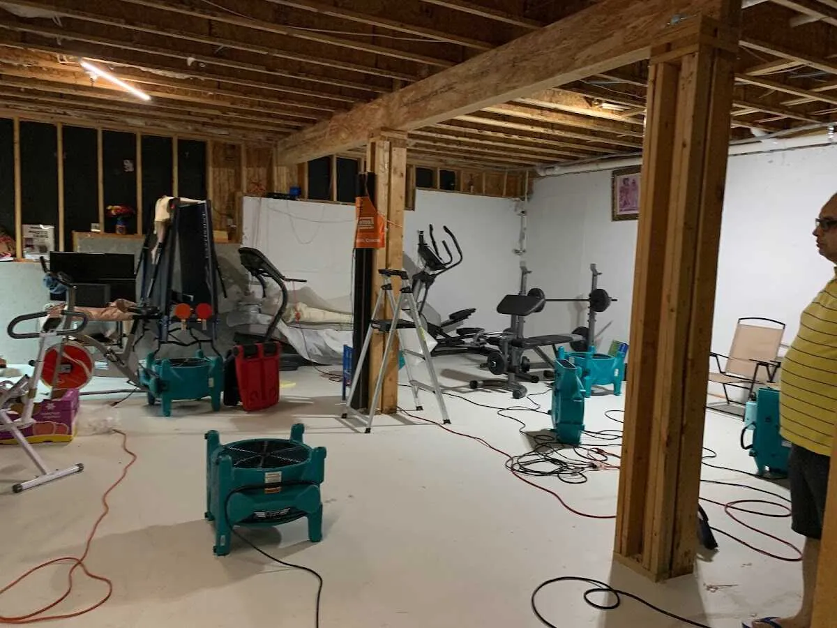 Basement drying equipment setup for Contents Cleaning & Restoration in Ashwaubenon